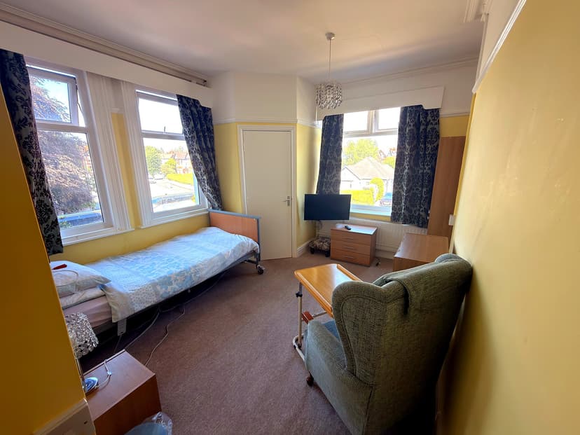 En-suite resident bedroom with natural light